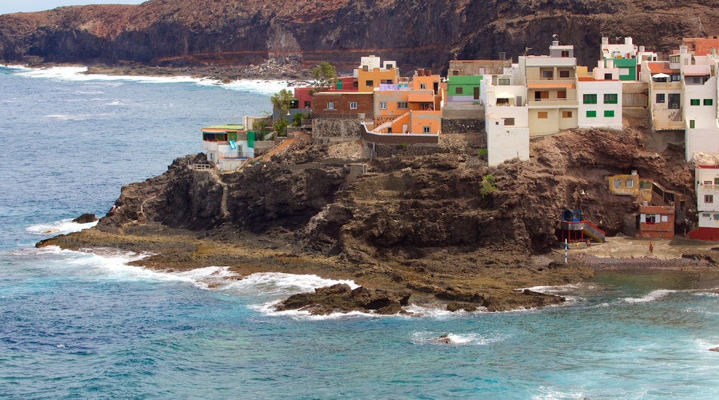 Gran Canaria featuring a coastal town, a pebble beach and general coastal views