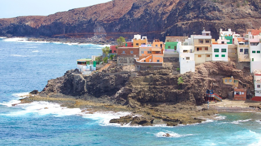 Gran Canaria showing a coastal town, rocky coastline and general coastal views