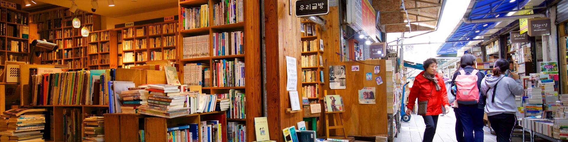 A bookstore with wooden shelves filled with books.
