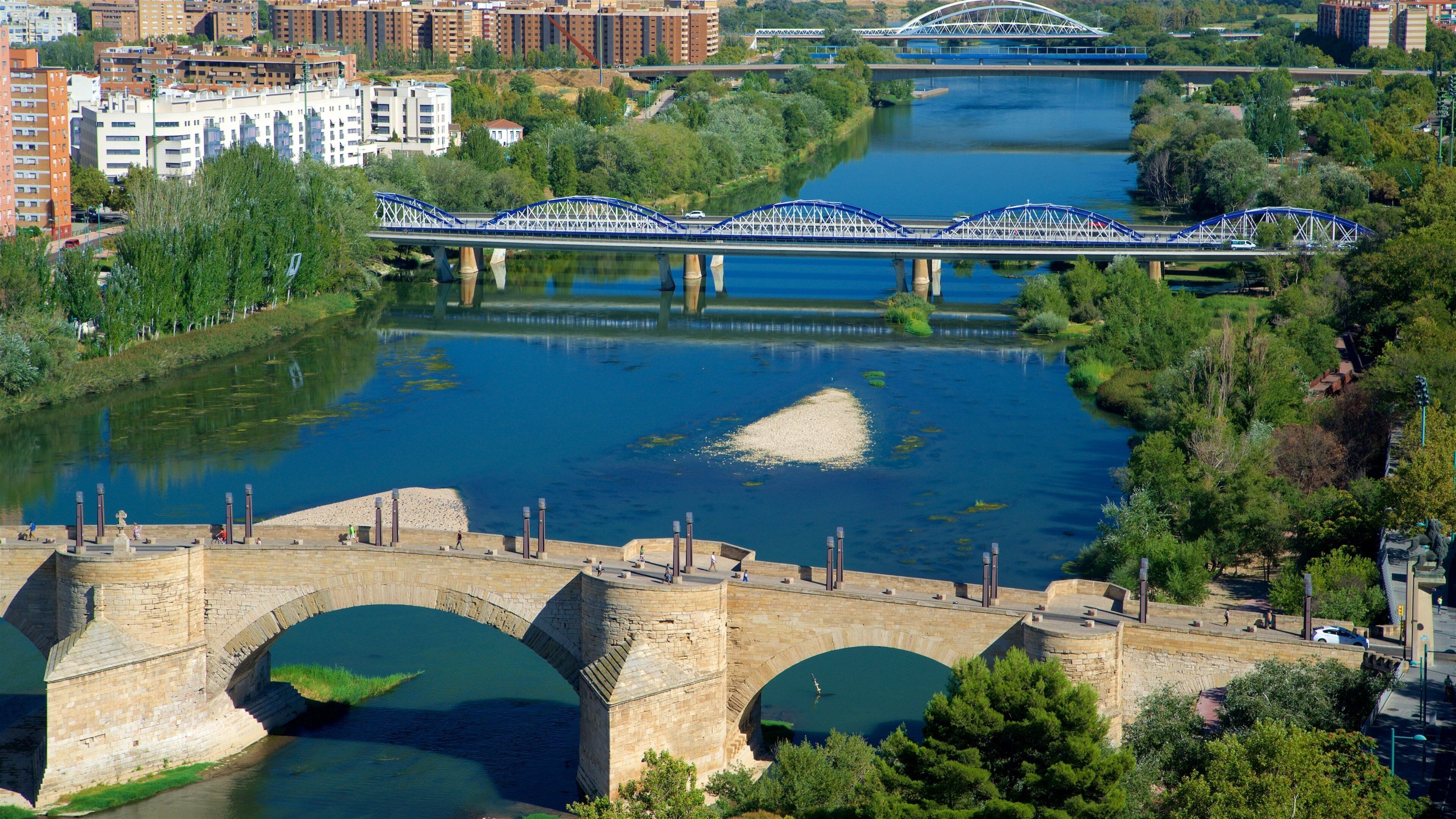 Puente de Piedra featuring a city, a river or creek and a bridge