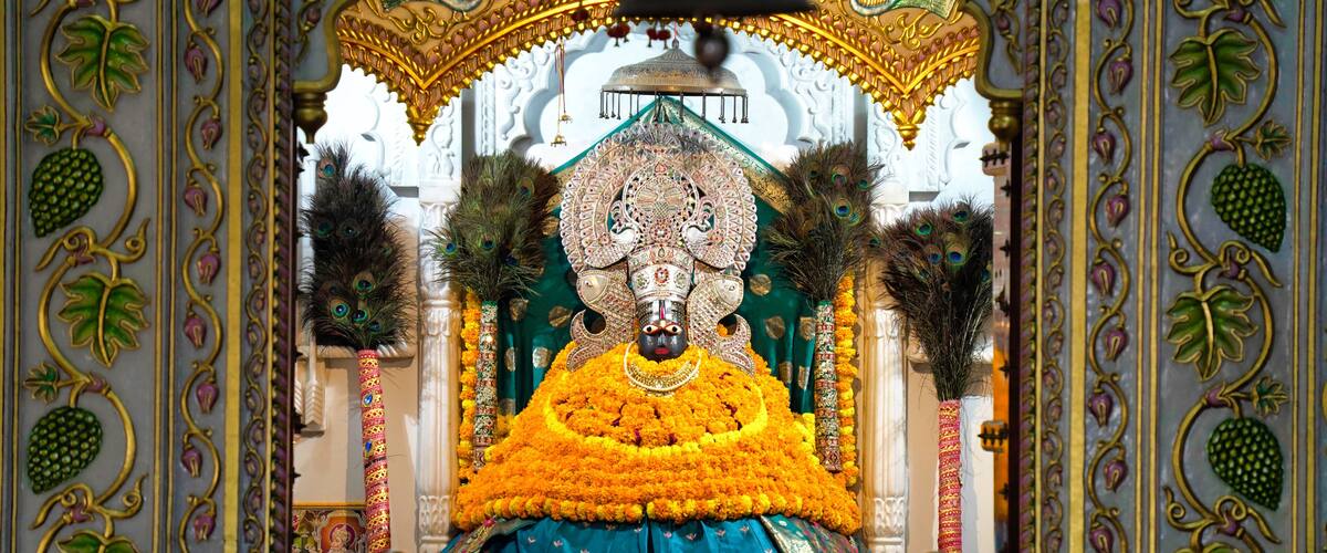 Lord Khatu Shyam ji Baba, form of Lord Krishna decorated with colorful garlands in Khatu. Shyam is a name and manifestation of Barbareek, grandson of Bhim and Hidimba in Mahabharata.