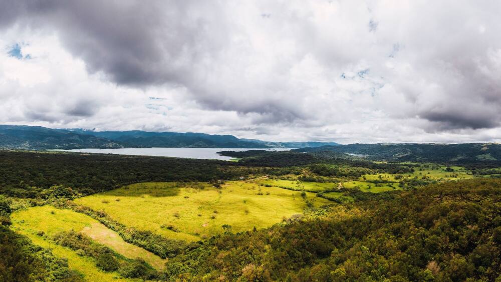 Cloudy sky over green landscape at Arenal Volcano, Arenal Volcano National Park, La Fortuna, Alajuela Province, Costa Rica
