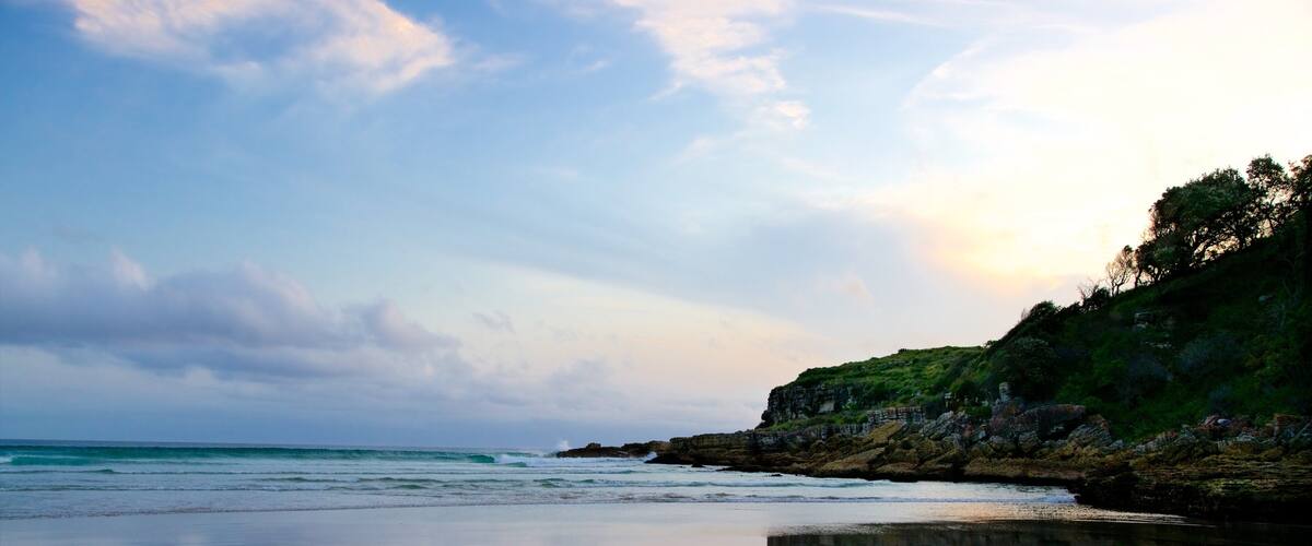 Caves Beach showing general coastal views and a sunset