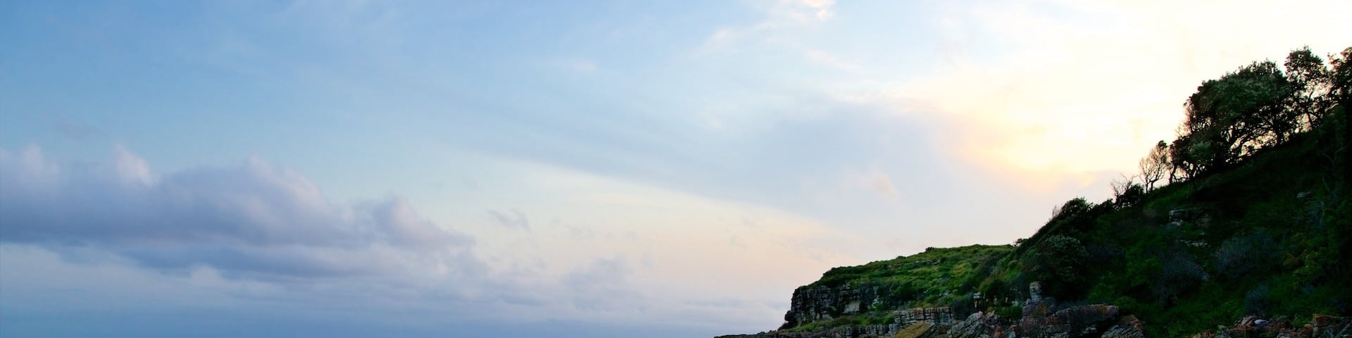 Caves Beach showing general coastal views and a sunset