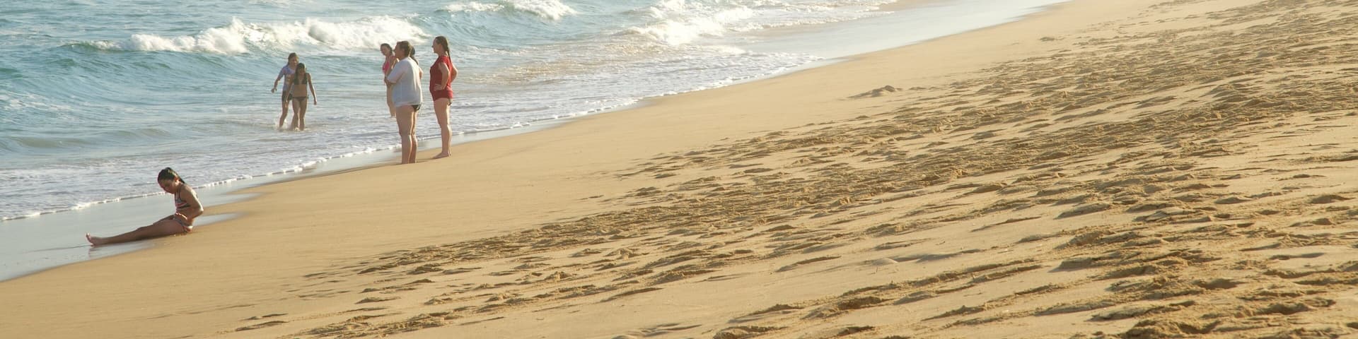 Gippsland showing a beach, a bay or harbor and surf