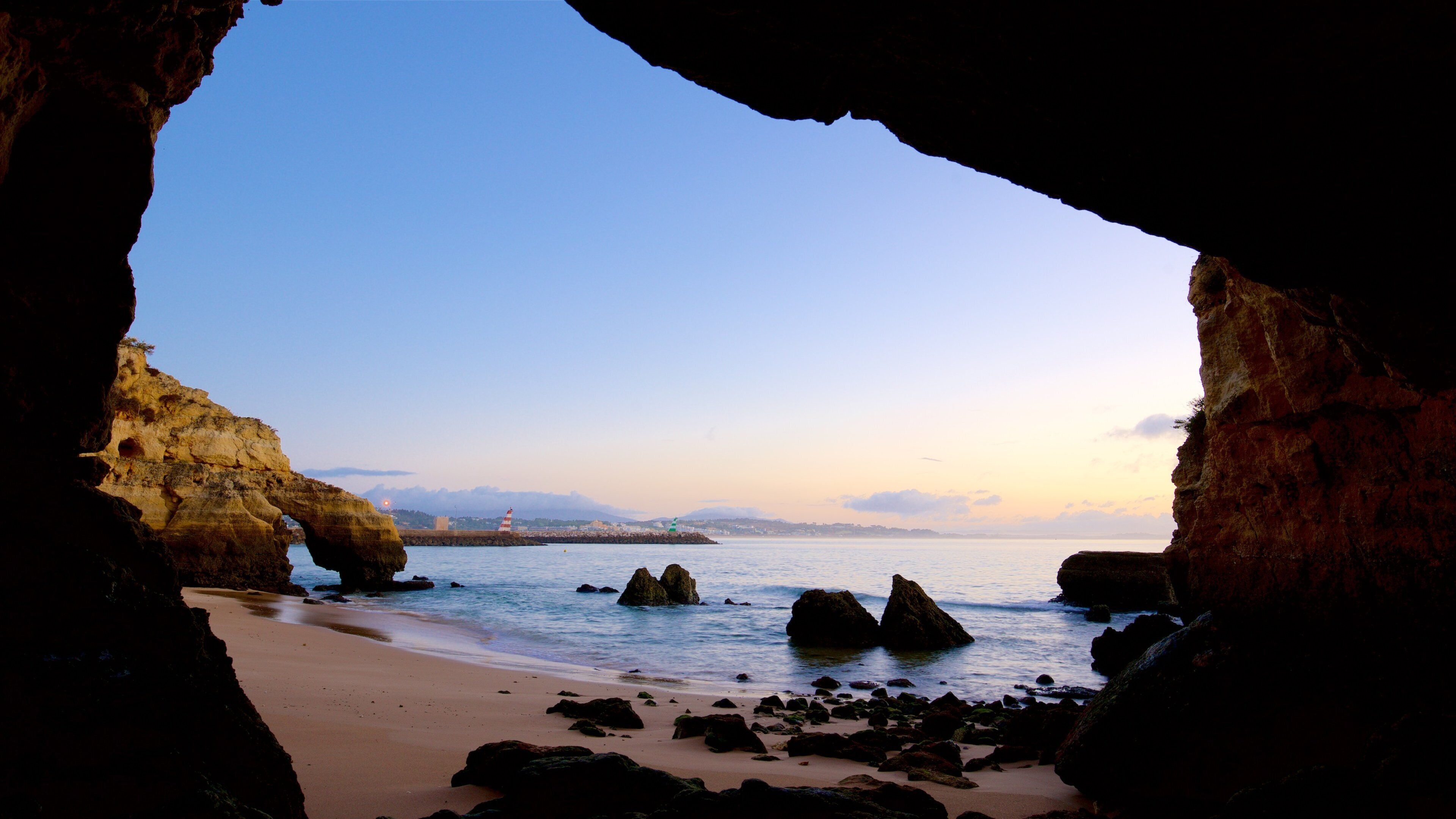 Lagos featuring a sunset, general coastal views and rocky coastline