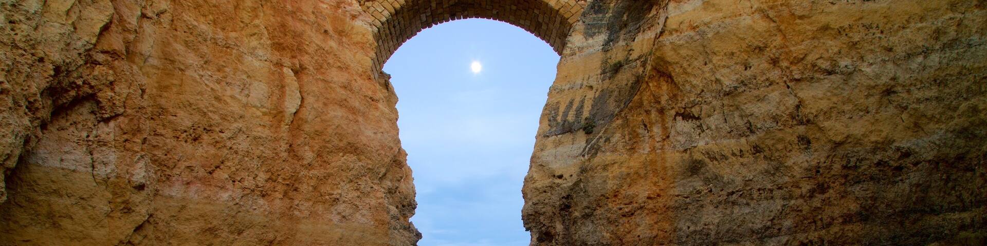 Lagos which includes a bridge, rocky coastline and general coastal views