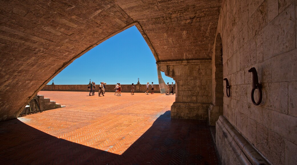 Gubbio which includes a square or plaza and heritage elements as well as a small group of people