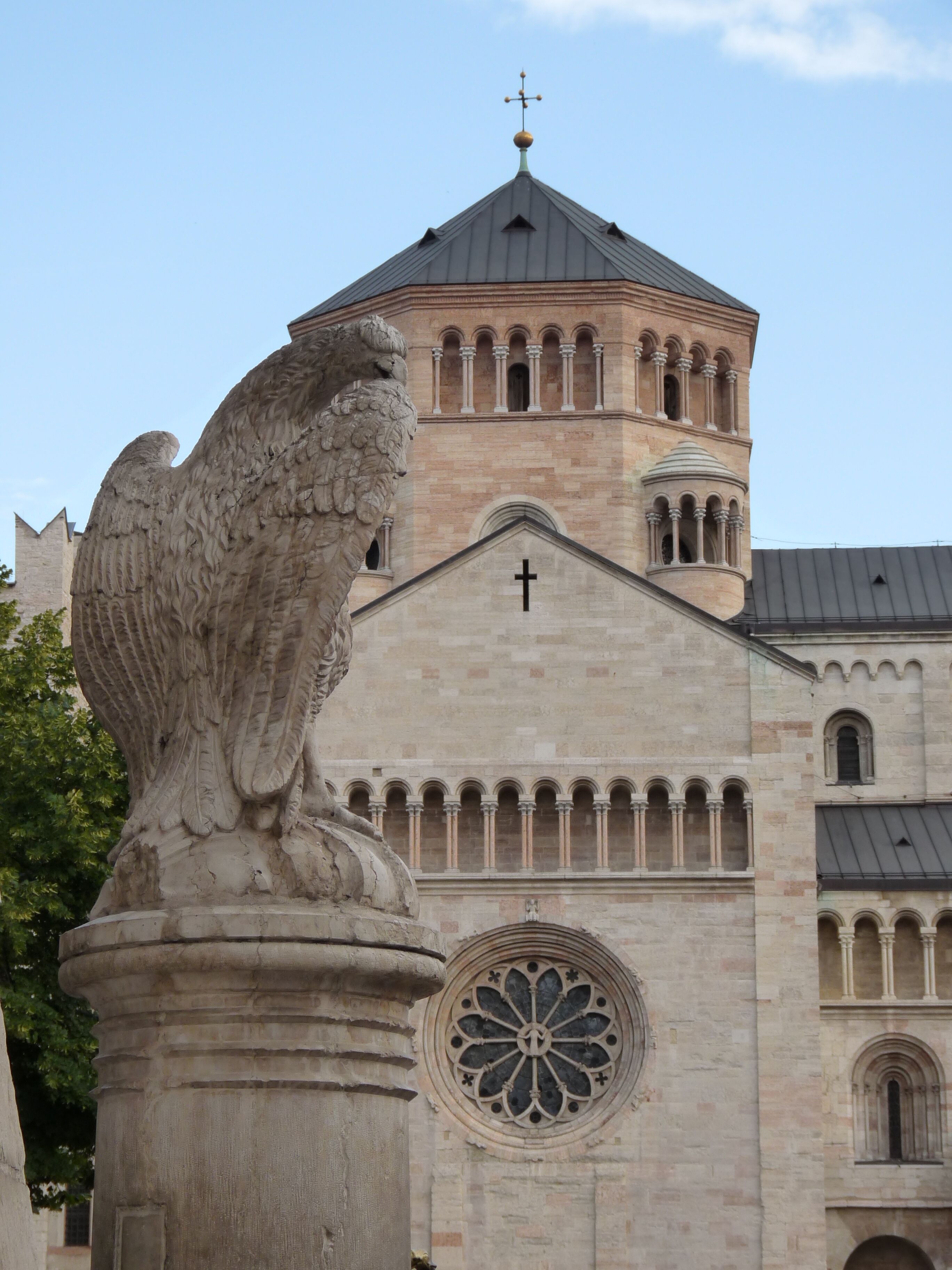 Trento (Italy): fountain of the Eagle in Piazza del Duomo (Stefano Varner, 1850) with the northern transept of the cathedral of Saint Vigilius in the background