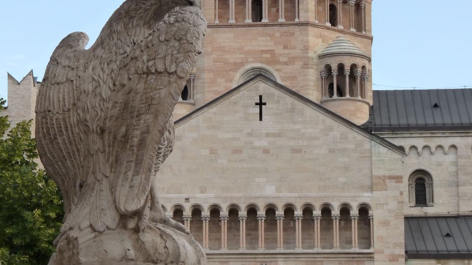 Trento (Italy): fountain of the Eagle in Piazza del Duomo (Stefano Varner, 1850) with the northern transept of the cathedral of Saint Vigilius in the background