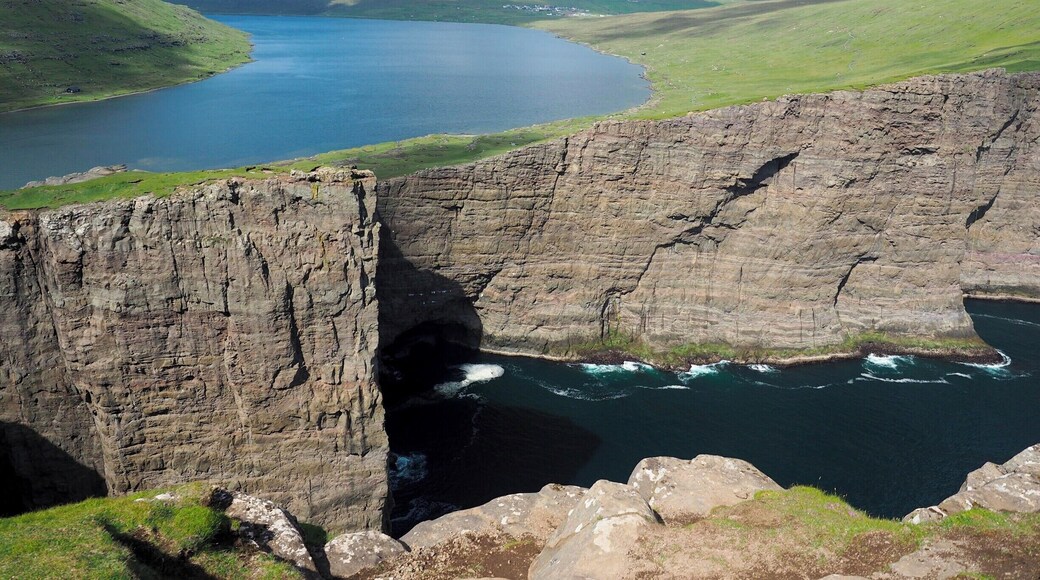 Looking for an easy hike in the Faroe Islands that still has incredibly epic views? Look no further than Trælanípa, which is a hike to the top of sea cliffs on the island of Vagar.
You start your hike by skirting the edge of Sørvágsvatn, the largest lake in the country. Once you're at the top of the cliffs, the lake appears to be "floating" above the sea!