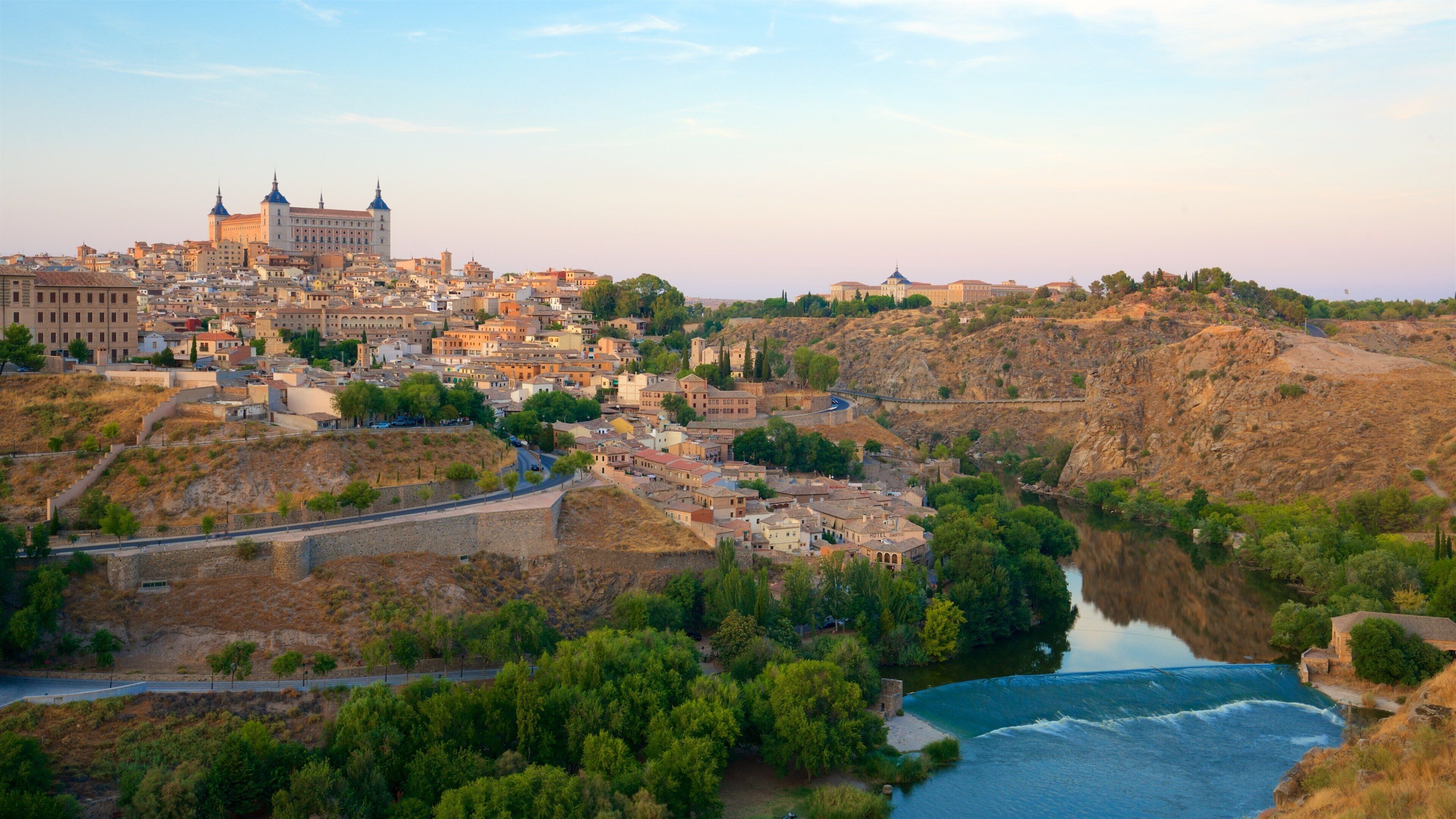 Mirador Del Valle showing landscape views, a sunset and a river or creek