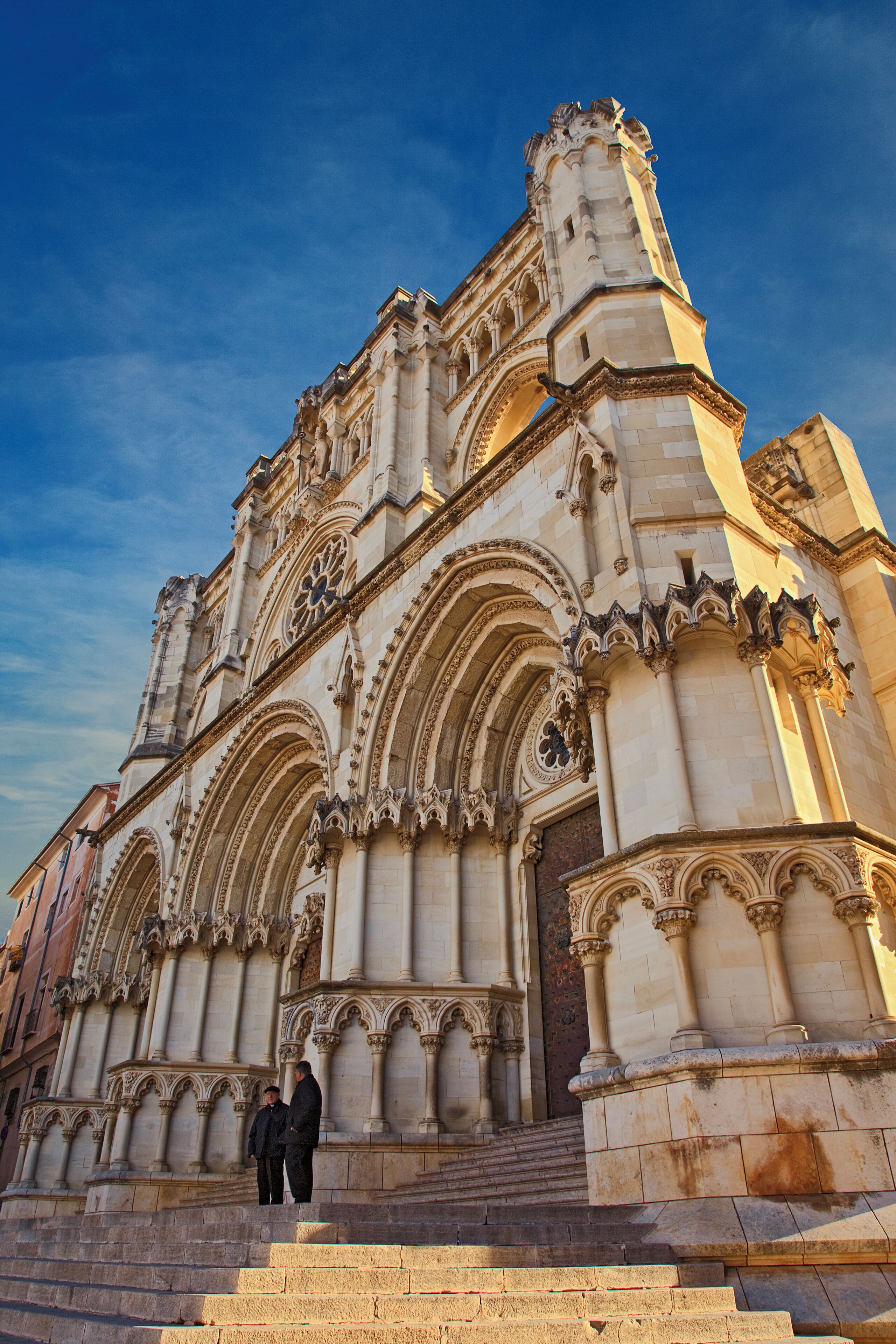 A historic cathedral with intricate Gothic architecture, including pointed arches and detailed stone carvings.
