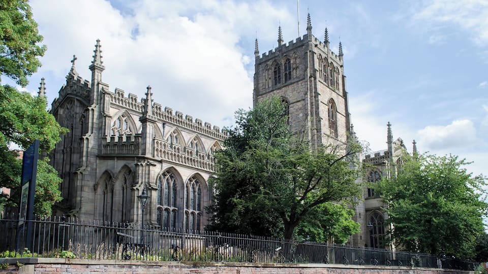The church dates from the 15th century, although it was built over an earlier 12th century church and some late 14th century fragments were incorporated. It was completed in 1474 and is a good example of perpendicular architecture. In 1844, the church was very nearly demolished, but there were several restorations undertaken by various architects including Sir Gilbert Scott. The church is a cruciform plan with a crossing tower and transepts. There is a nave with north and south aisles and clerestory. There is a choir and chancel, south chapel, south porch, and to the north there is a chapter house and vestry. The nave has six bays and many stained-glass windows. The roof has carved Angels on the corbels, and is by Scott. The tower is situated over the crossing, and has oak replacement vaulting as the original was destroyed in 1558 during a storm. There are 12 bells. The choir has stalls and a Bishops throne by Scott from 1871. The mediaeval choir stalls were sold to Sneinton church. The screen is by Bodley and Garner. The south Chapel was built in 1913 and some windows contain reset fragments of mediaeval stained glass. The south porch dates from the early 15th century, but the doors of bronze are by Henry Wilson from 1905. The organ in the south transept is by Marcussen and from 1973. The font dates from the 15th century with a modern cover.