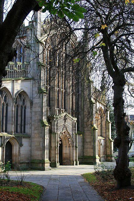 A historic building with Gothic architecture, including pointed arches and detailed stonework.
