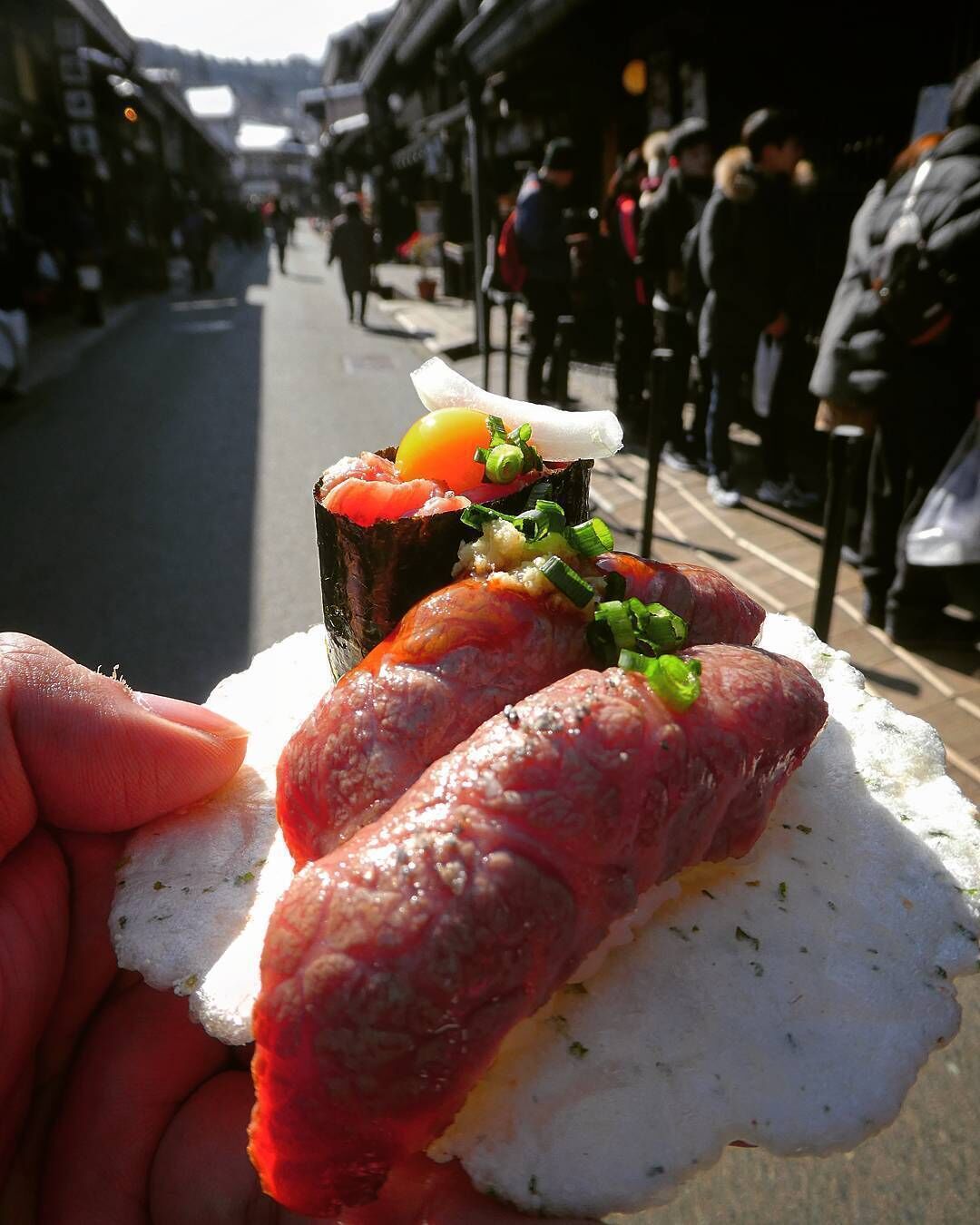 #beef #Takayama #Japan #hidabeef #food #culinary #LikeALocal #trovember

Not as widely known or famous as its cousin the Kobe beef, nonetheless, the Hida beef represents the pinnacle of food ingredient's quality that Japan is famous for. The term Hida beef itself is specifically given to the beef from black-haired cattle that have been raised in #Gifu perfecture for at least 14 months, with the beef to have to be at least grade B and texture grade of 3. Considered as the ideal #wagyu because the marbling doesn't onley permeates through the tender steak cut but also every part of the cow's meat. The juiciness and the freshness of the meat means that it can be eaten raw and often sold as sushi throughout cities in Gifu perfecture such as Takayama and Kanazawa.

If you want to get the best out of your Hida beef culinary tour try putting the small beautiful old town of Takayama in your itinerary which is considered as the center for Hida beef culinary. Here, Hida beef can be found everywhere and cooked in varieties of ways from sukiyaki, yakiniku, to even beef jerkies. A definite must try is the Hida beef sushi that are sold mostly by street peddlers on street of the old town. Each stall usually has its own unique rolls and toppings to complement the raw Hida beef and the waiting queue is usually about 15 - 40 minutes. Waiting in line to eat raw beef on the street might not feel like the best idea during vacation but trust me, it's worth the time :)