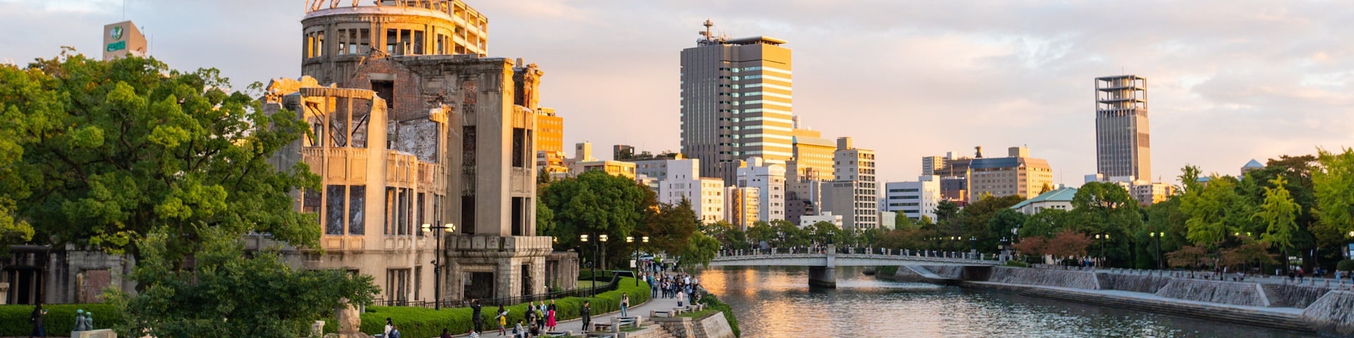 Hiroshima City Centre which includes a sunset, a river or creek and a city