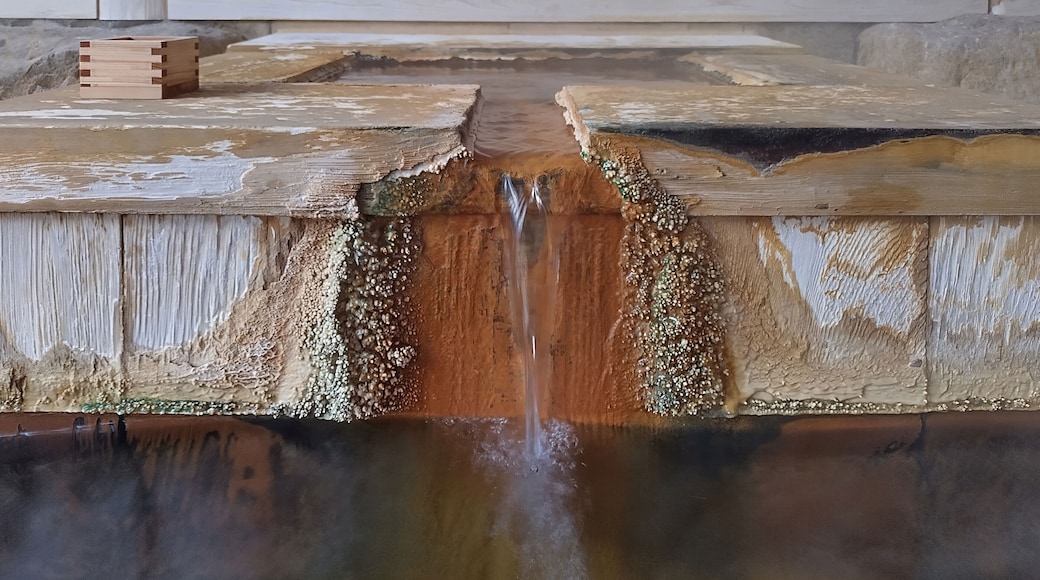 Old Japanese onsen hot spring fountain with mineral deposits