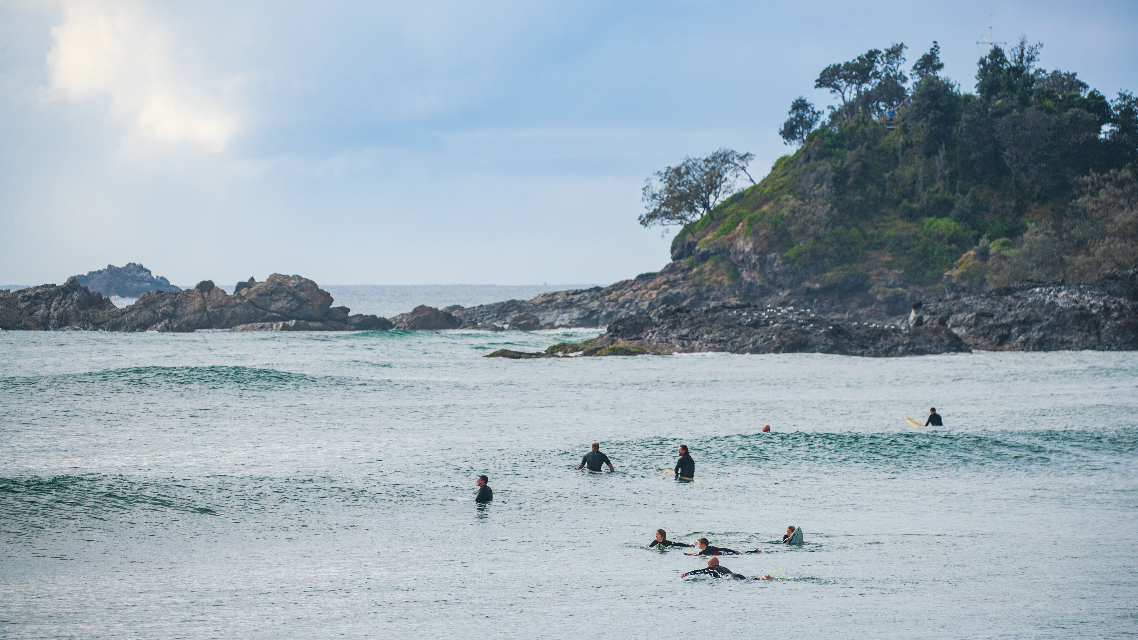 Town Beach which includes general coastal views and surfing as well as a small group of people