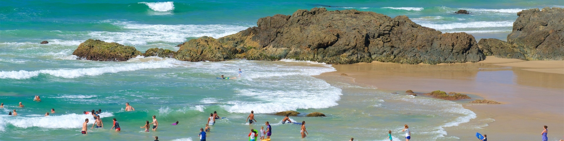 Port Macquarie featuring a bay or harbor, a sandy beach and rugged coastline
