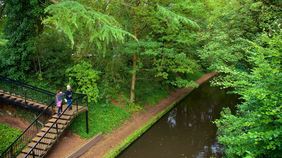 Warrington showing a park and a river or creek as well as a couple