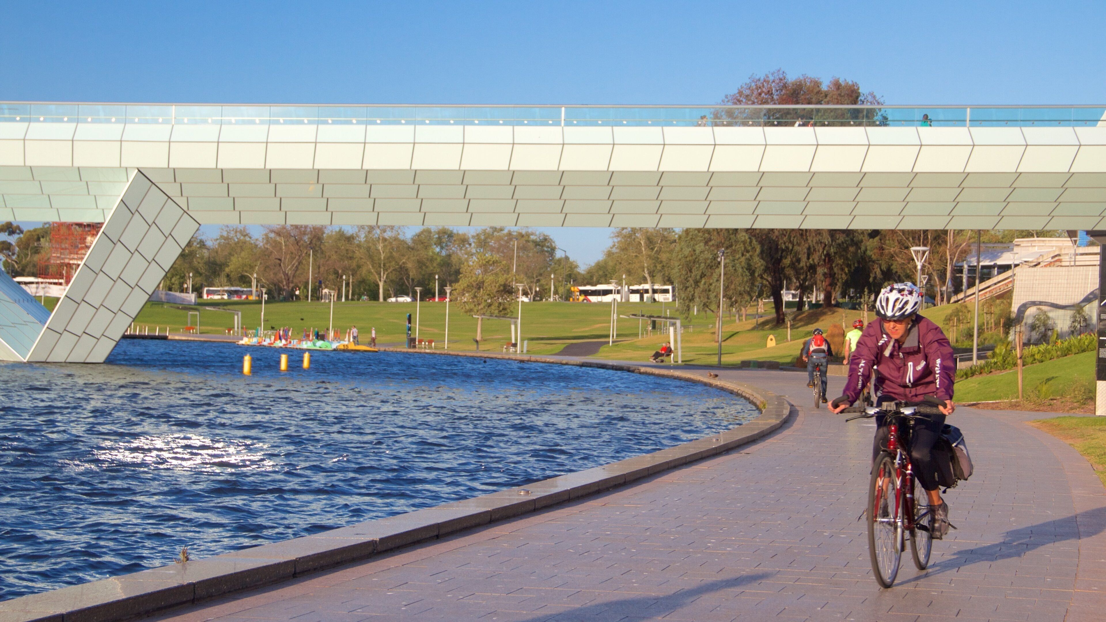 Adelaide featuring cycling, a lake or waterhole and a bridge