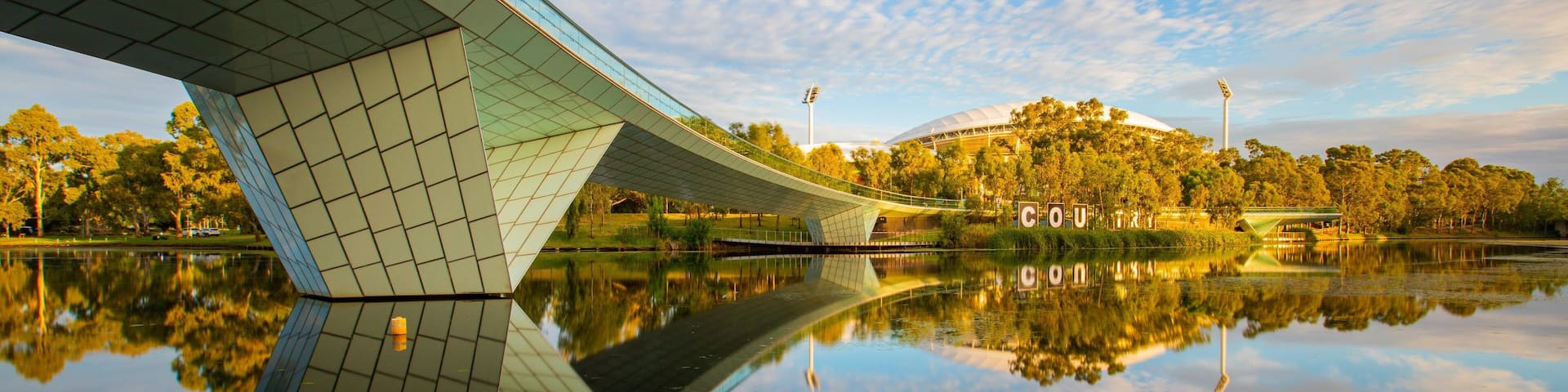 River Torrens Footbridge which includes a river or creek, a sunset and a bridge