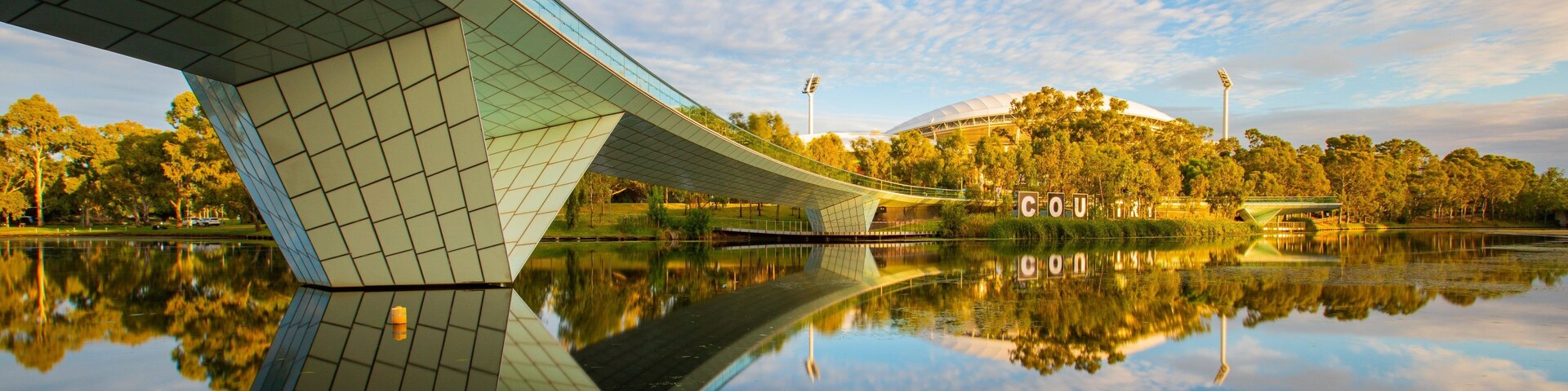 River Torrens Footbridge which includes a river or creek, a sunset and a bridge