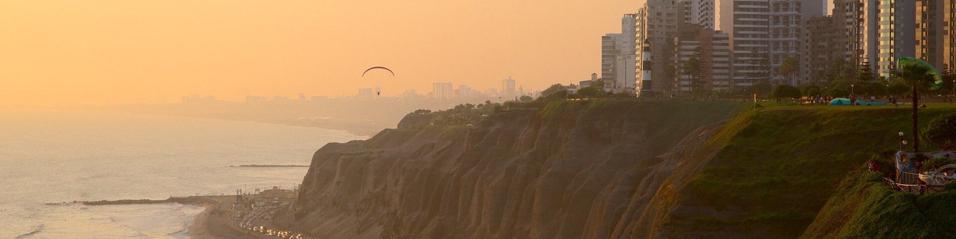 Lima showing a sunset, a city and general coastal views