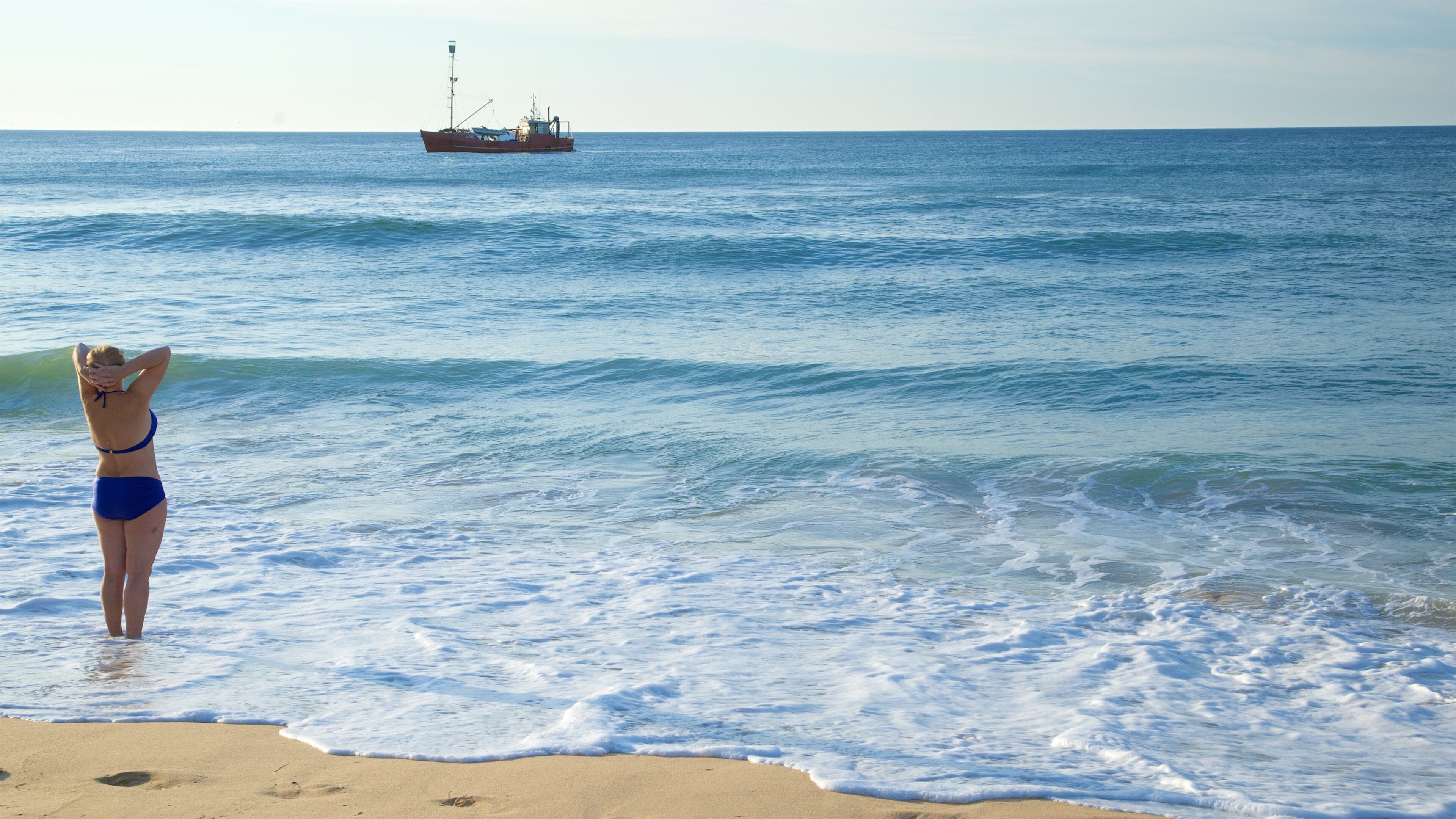 Gippsland featuring boating, a sandy beach and a bay or harbour