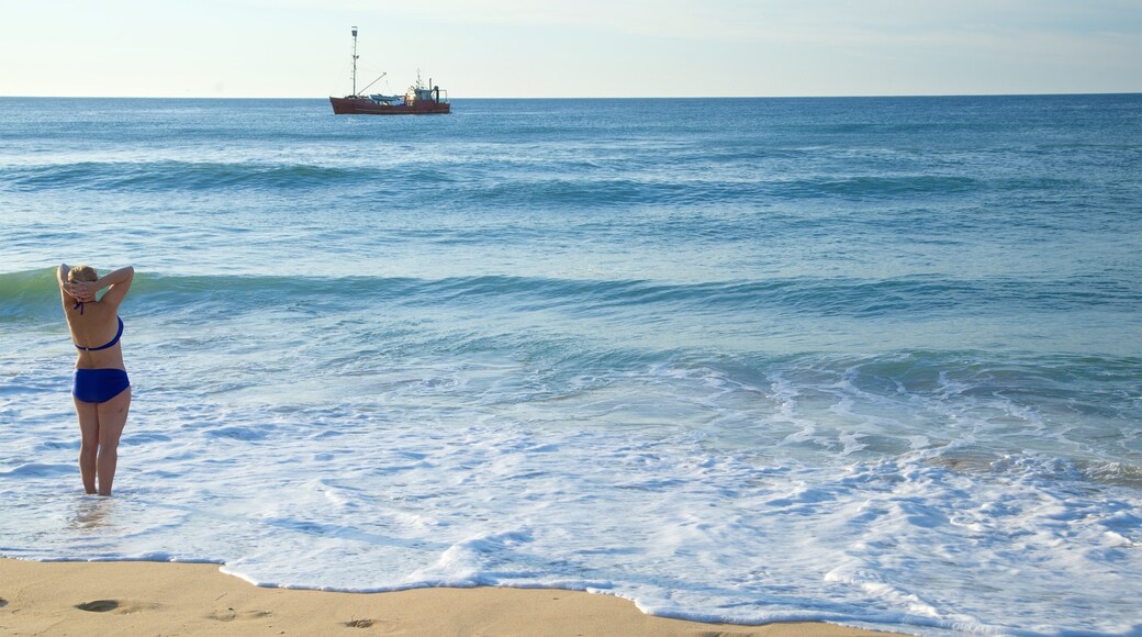 Gippsland featuring boating, a sandy beach and a bay or harbour