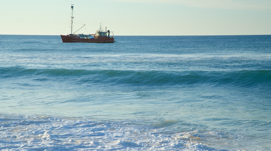 Main Beach which includes general coastal views, a sunset and boating