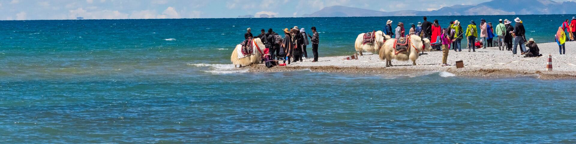 Tourists on the shore of Namtso (Lake Nam), Tibet, China