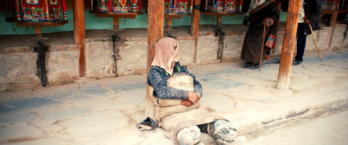 The Kora in Labrang Monastery. The Kora is a sacred circular path around the monastery, that people walk in order to pray.