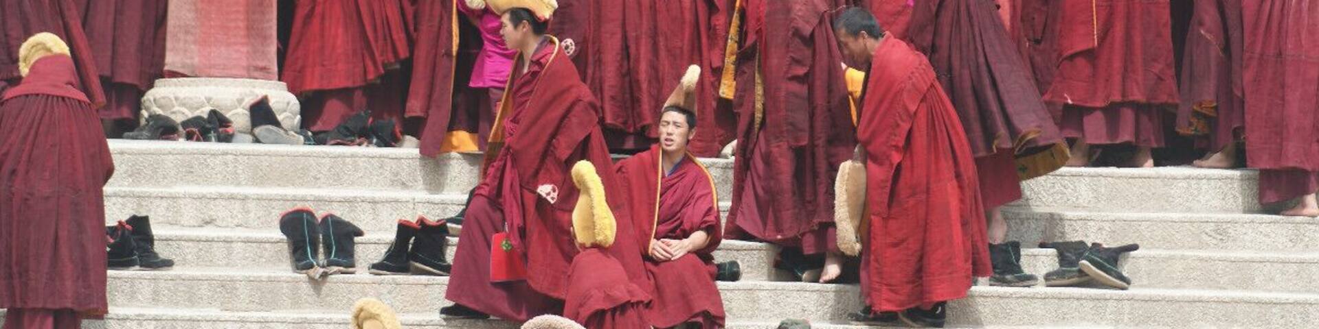 Monks entering the Main Temple. Labrang is the biggest lamasery of the Yellow Hat Sect outside Tibet