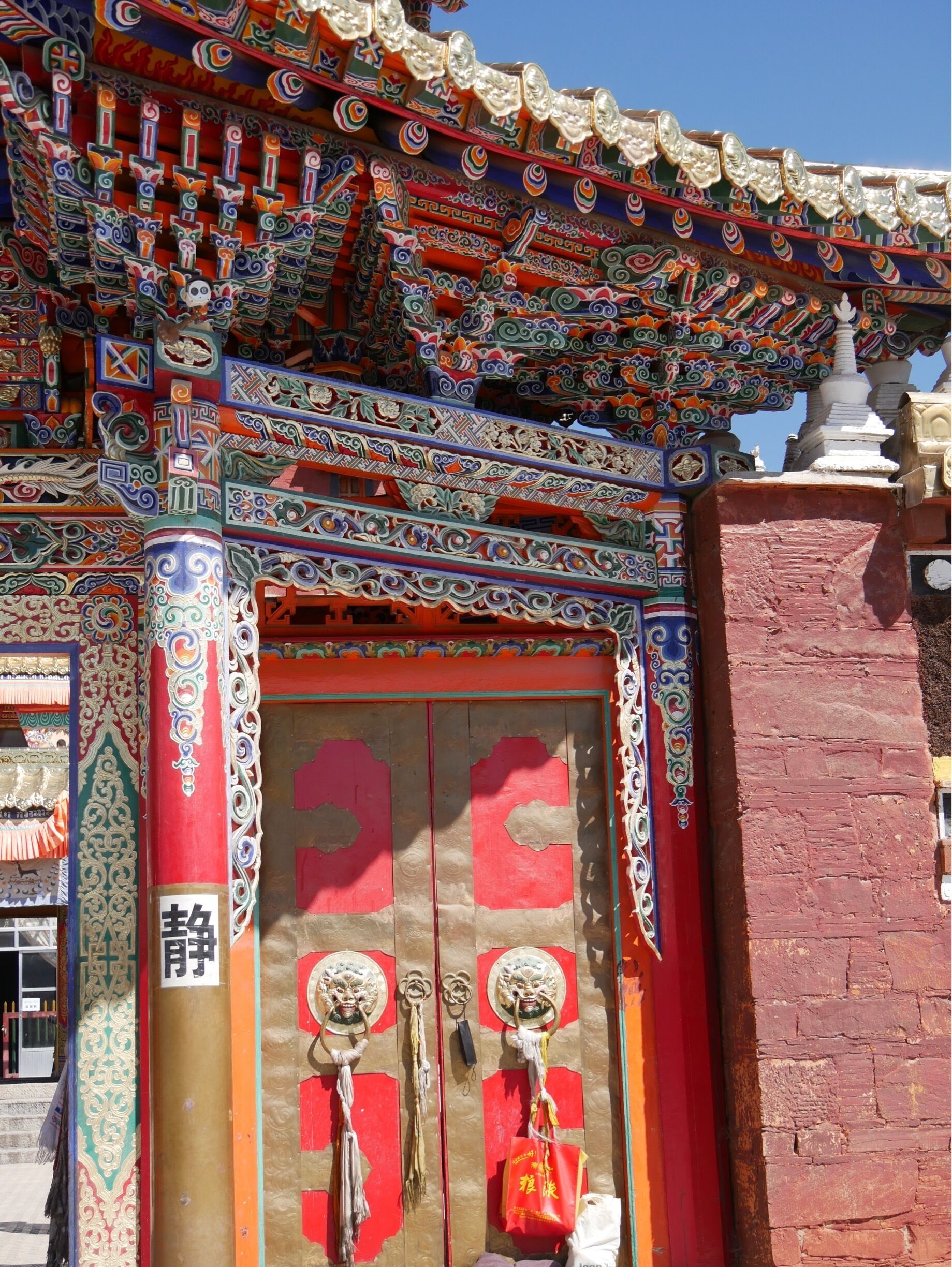 Entrance to Milarepa Palace/Pavilion/Temple about 10 km outside of Xiahe, China. Originally built in the 1100s by the Tibetan Buddhist philosopher Milarepa. Mostly destroyed in the Cultural Revolution and now rebuilt.