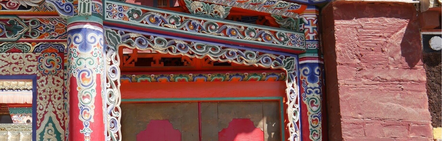 Entrance to Milarepa Palace/Pavilion/Temple about 10 km outside of Xiahe, China. Originally built in the 1100s by the Tibetan Buddhist philosopher Milarepa. Mostly destroyed in the Cultural Revolution and now rebuilt.