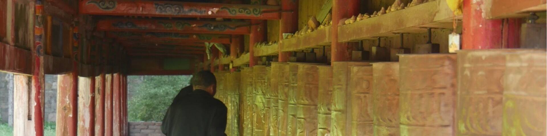 Pilgrim walking the kora at Milarepa Palace.