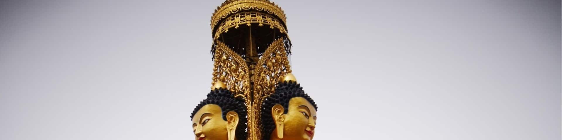 Two faces of a triple Buddha at the Lower Wutan Monastery, Rebkong, China.