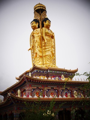 Two faces of a triple Buddha at the Lower Wutan Monastery, Rebkong, China.