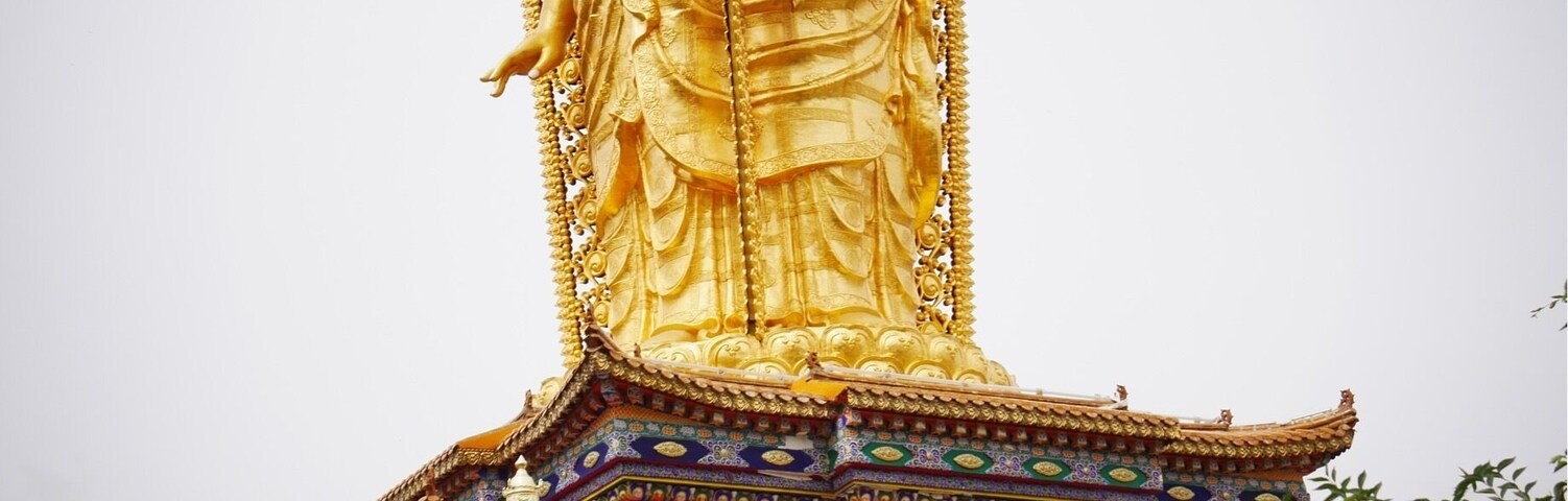 Two faces of a triple Buddha at the Lower Wutan Monastery, Rebkong, China.