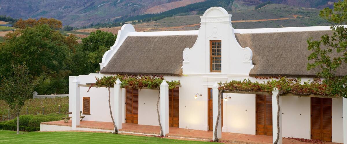 Babylonstoren which includes mountains and a small town or village