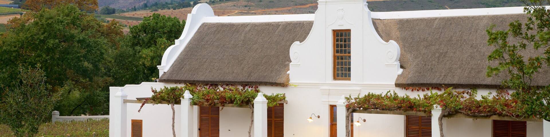 Babylonstoren which includes mountains and a small town or village