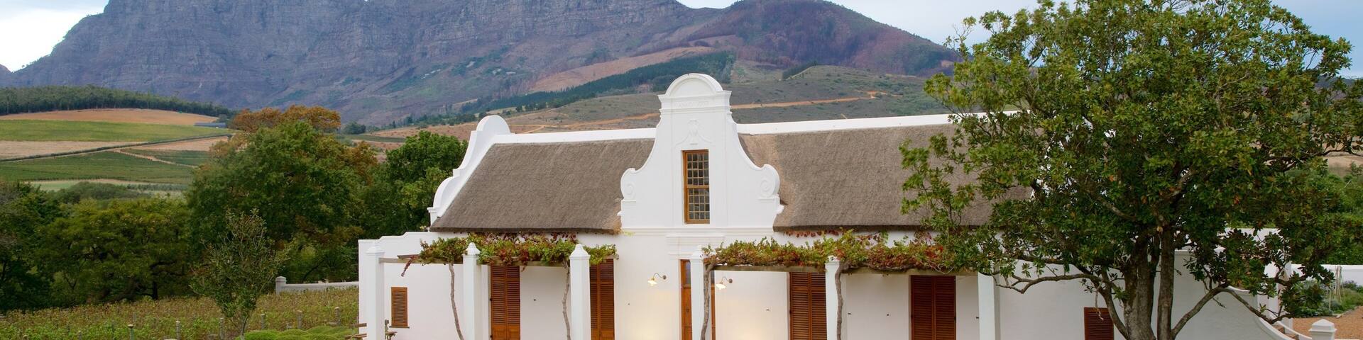 Babylonstoren which includes mountains, a small town or village and landscape views