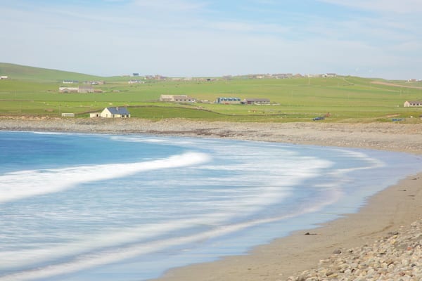 Stromness which includes a sandy beach, a pebble beach and a bay or harbour