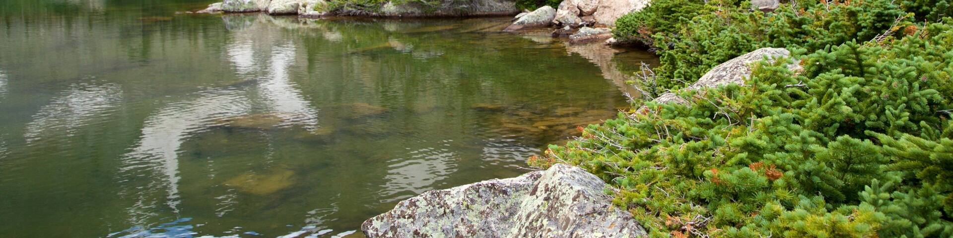 North Central Colorado featuring a lake or waterhole