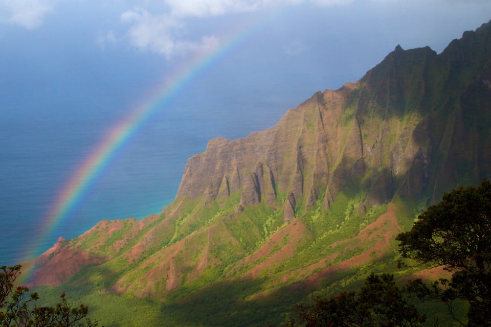 A mountain with a rainbow.