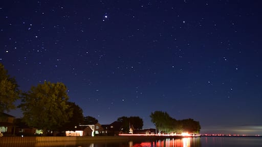 A night time view over the calm waters of Mitchell's Bay.