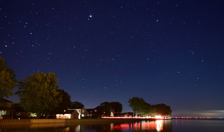 A night time view over the calm waters of Mitchell's Bay.
