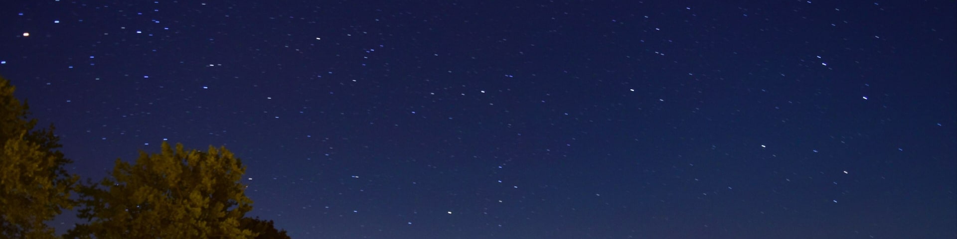 A night time view over the calm waters of Mitchell's Bay.
